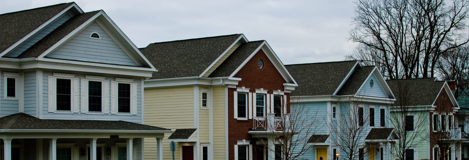 A row of brightly painted Victorian "painted lady" houses in downtown Greencastle, Indiana.